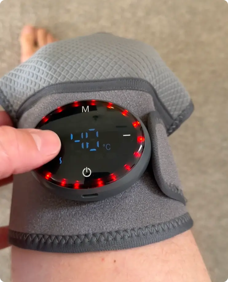 Person wearing Glokore Knee Massager for blood circulation and pain relief